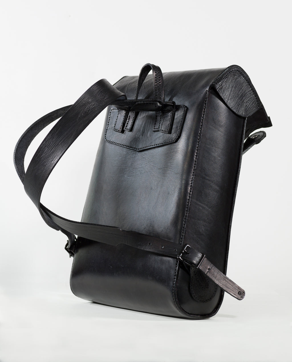 “Black VP Voyage Backpack with purple interior, angled detail view.”