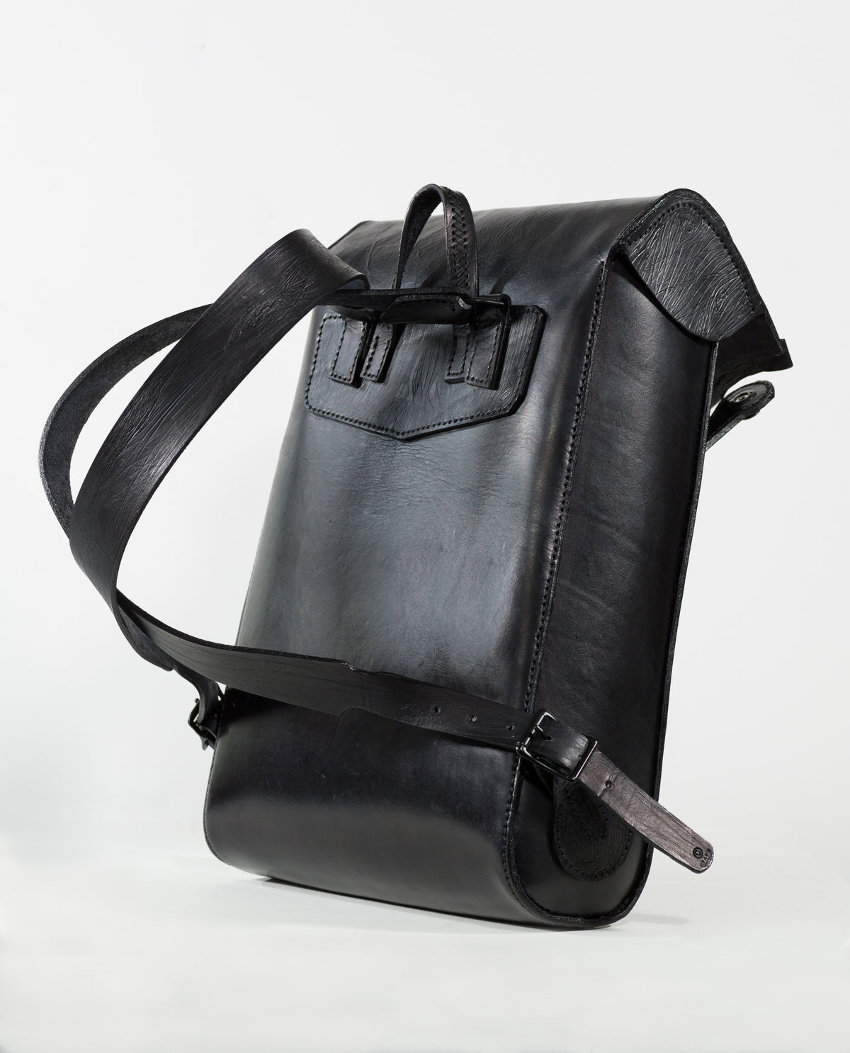 “Black VP Voyage Backpack with purple interior, angled detail view.”