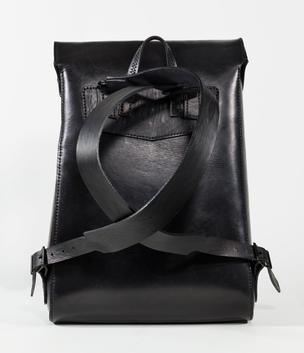 “Black VELA backpack showing the adjustable shoulder straps and rear view.”