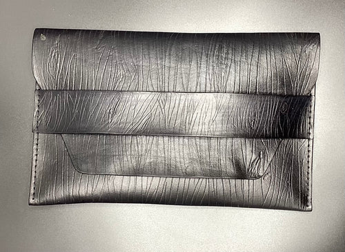 “Élan No. 01 Noir black leather envelope clutch, alternate view.”