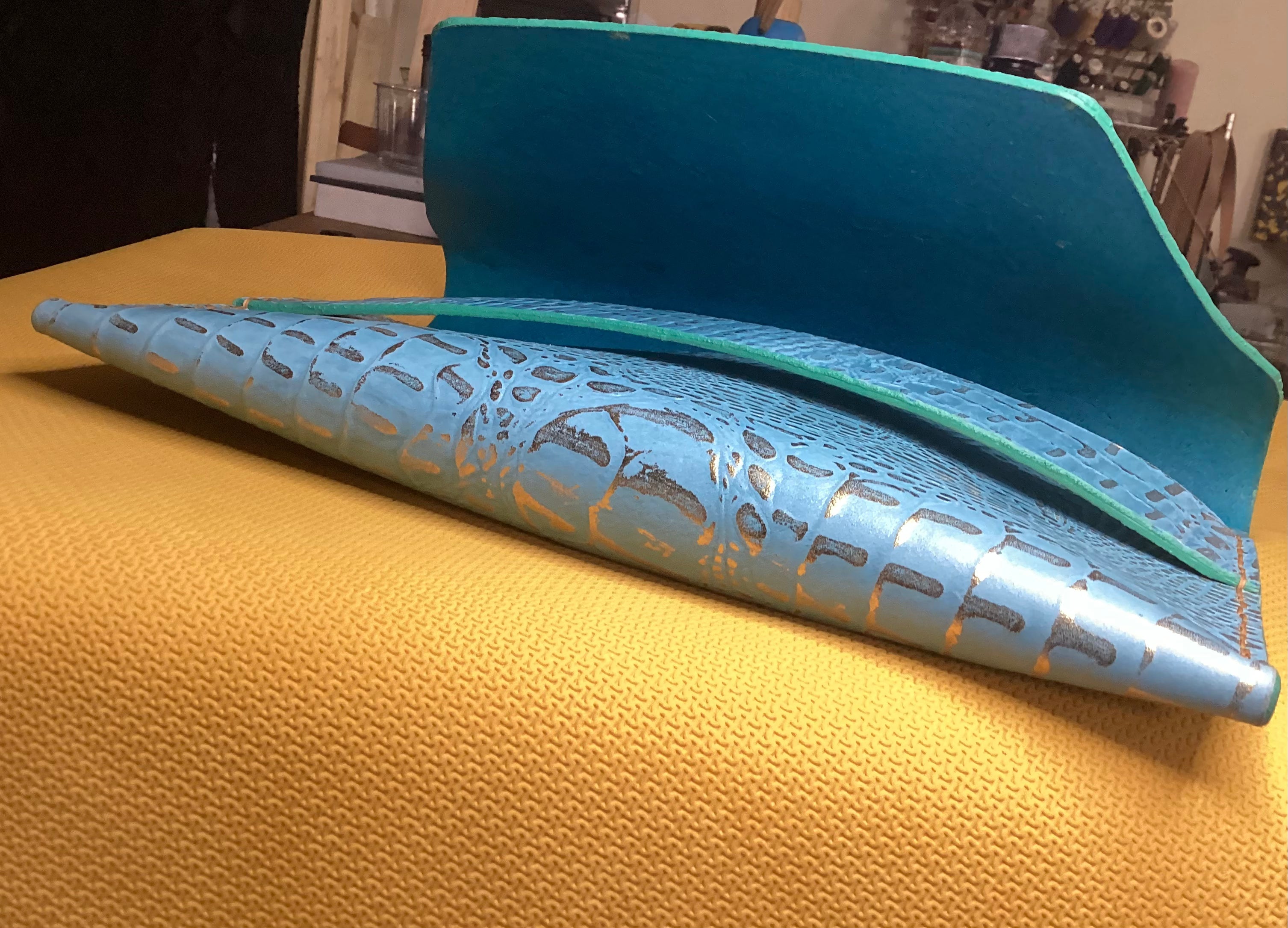 Turquoise Guilt envelope clutch, open view