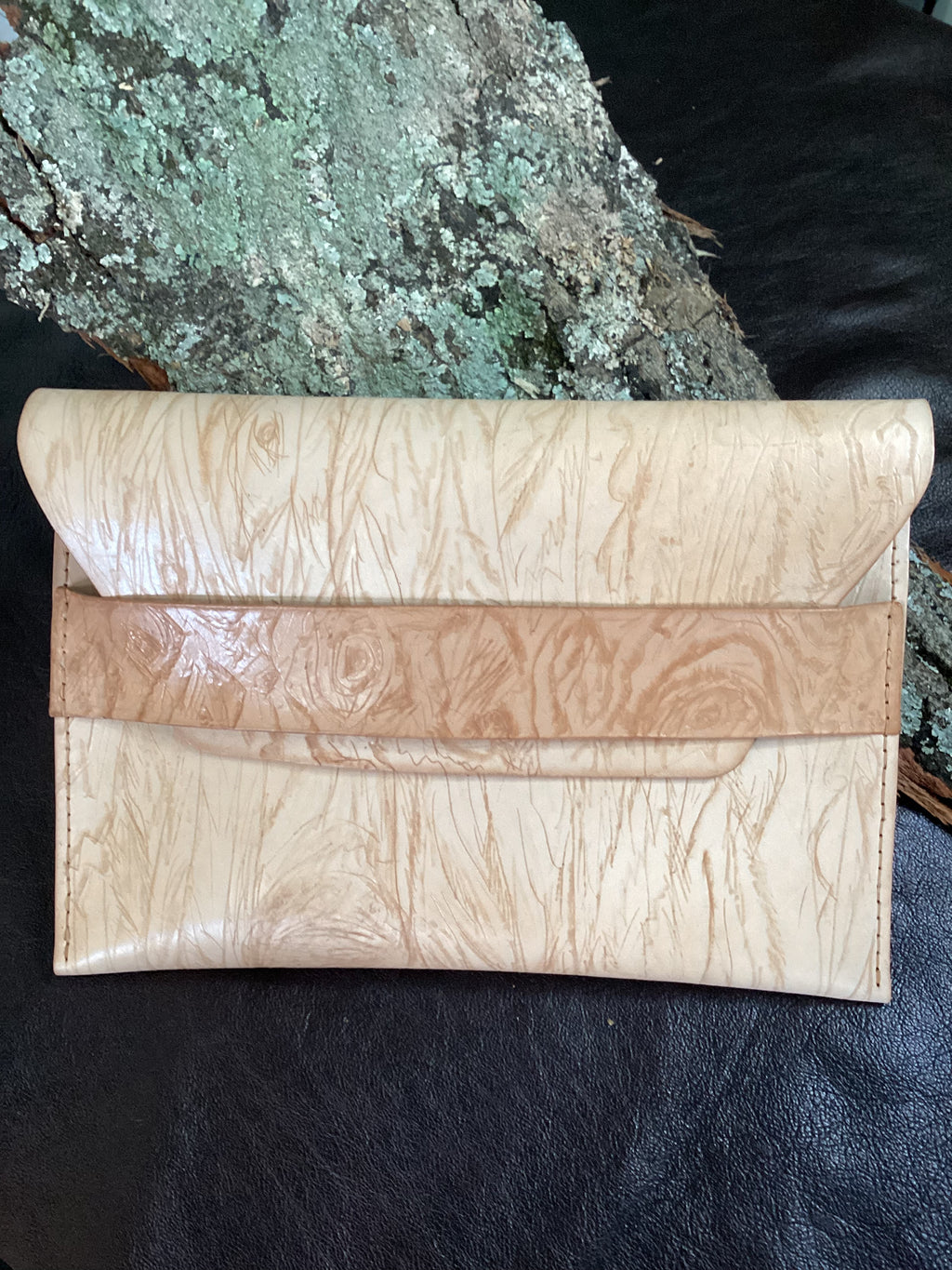 “Élan No. 03 Nude Grain clutch, alternate angled view.”