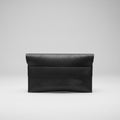 “Black Élan No. 01 Noir leather envelope clutch, front view.”
